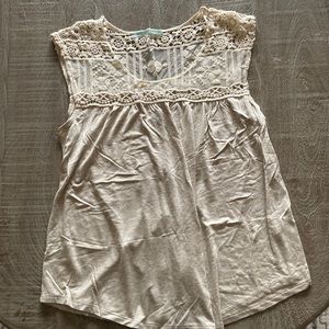Like new adorable tank top. Buttons on the back and crocheted lace top.